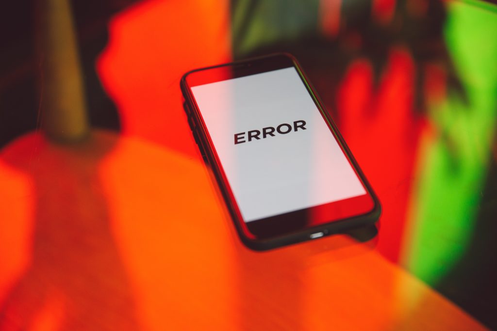 Image of a cell phone with the word "error" displayed