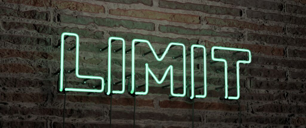 Realistic light green Neon Sign spelling out the word limit on Brick Wall background