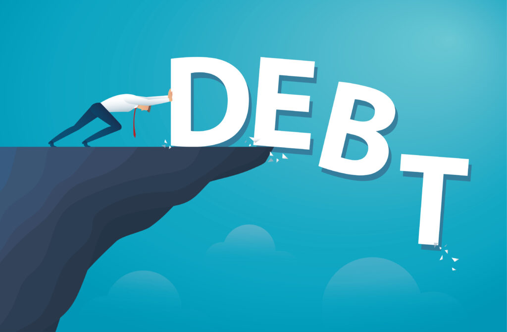 Drawing of man pushing the letters of the word debt off a cliff edge